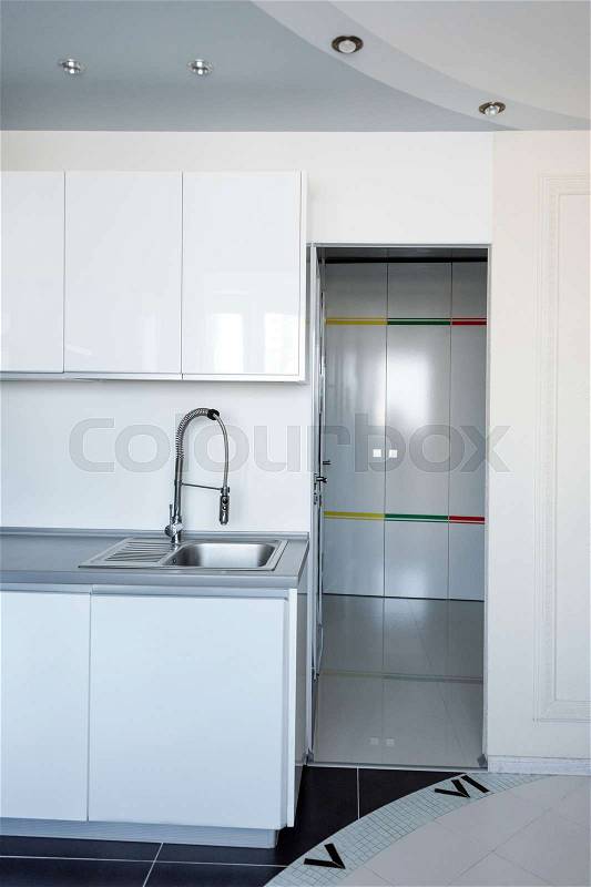 Interior of modern kitchen in a spacious apartment, stock photo