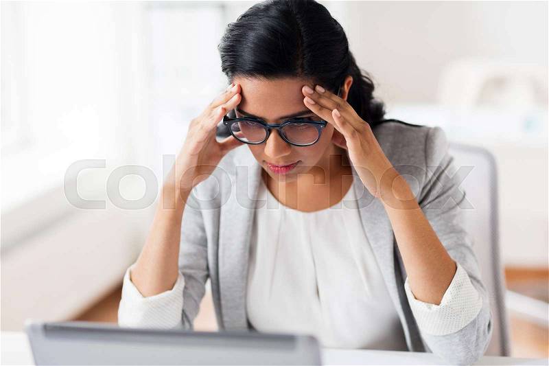 Business, people, deadline and technology concept - stressed businesswoman with laptop computer at office, stock photo