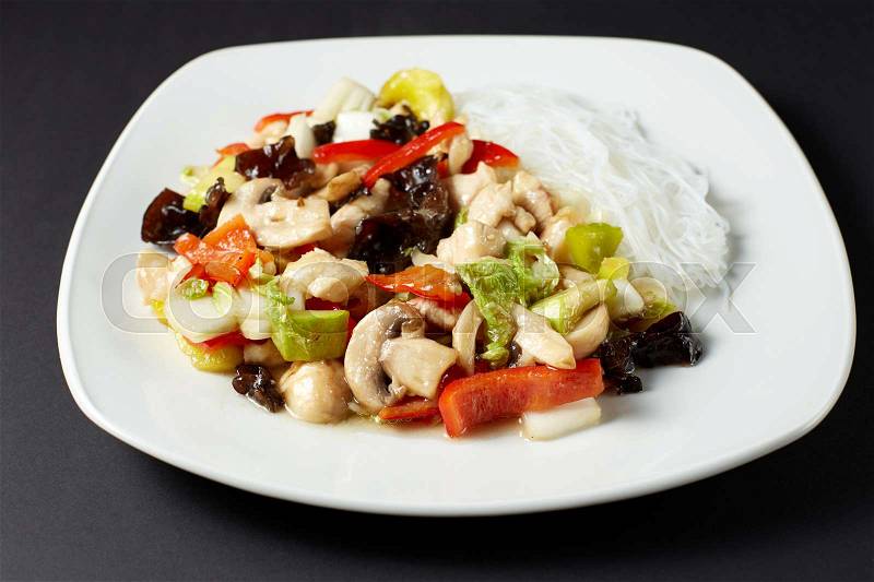 Chicken Szechuan. Asian food. Asian cuisine. Studio shot on dark or black background, stock photo