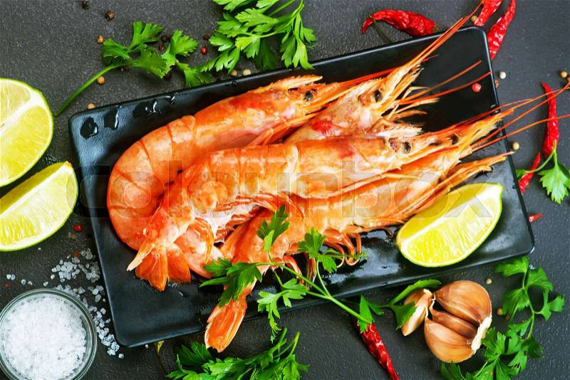 Boiled shrimps with salt and spice on a table, stock photo