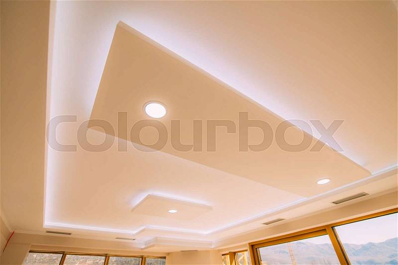 Stretch ceiling film. The design of the apartment. Renovated apartment. Design interior of the living room, stock photo