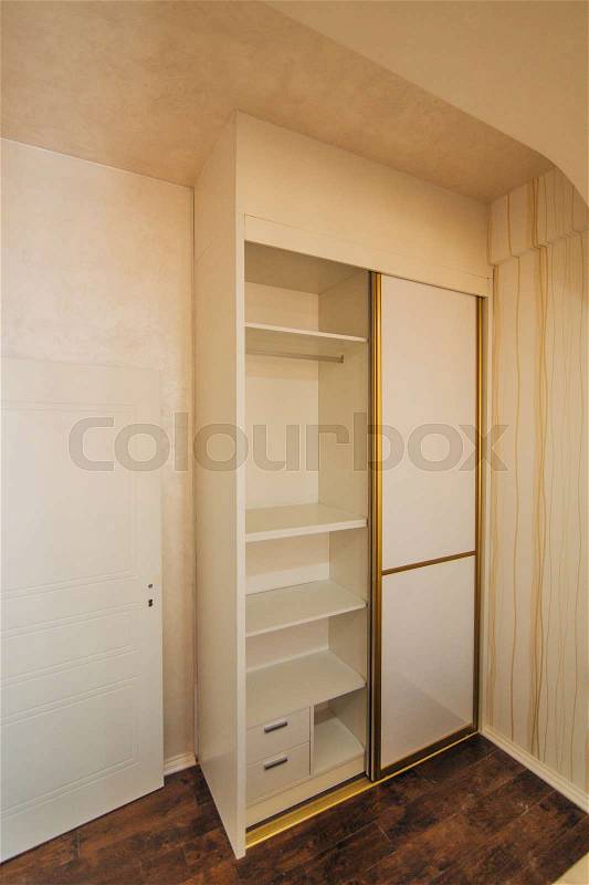 Wardrobe in the apartment. Interior design bedroom, stock photo