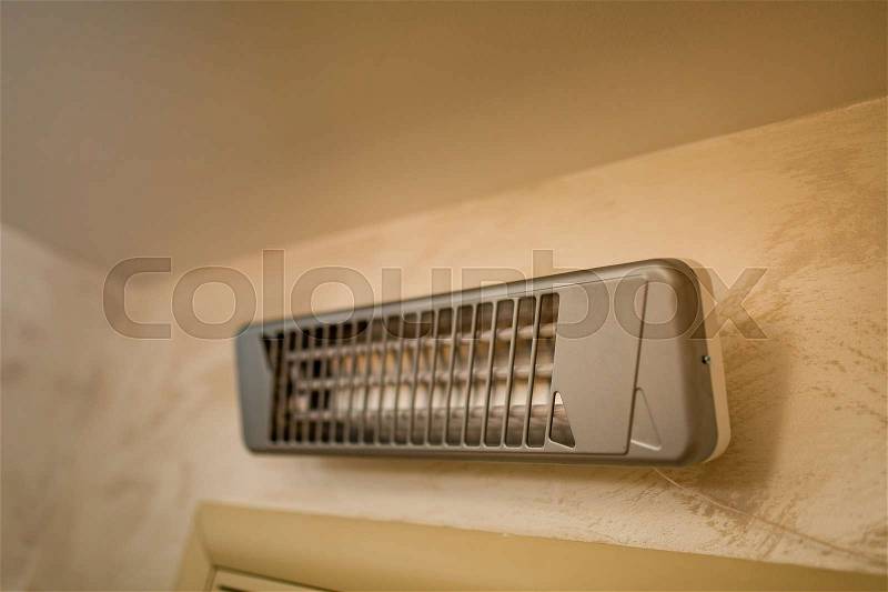 Infra-red heater on the wall in the bathroom, stock photo