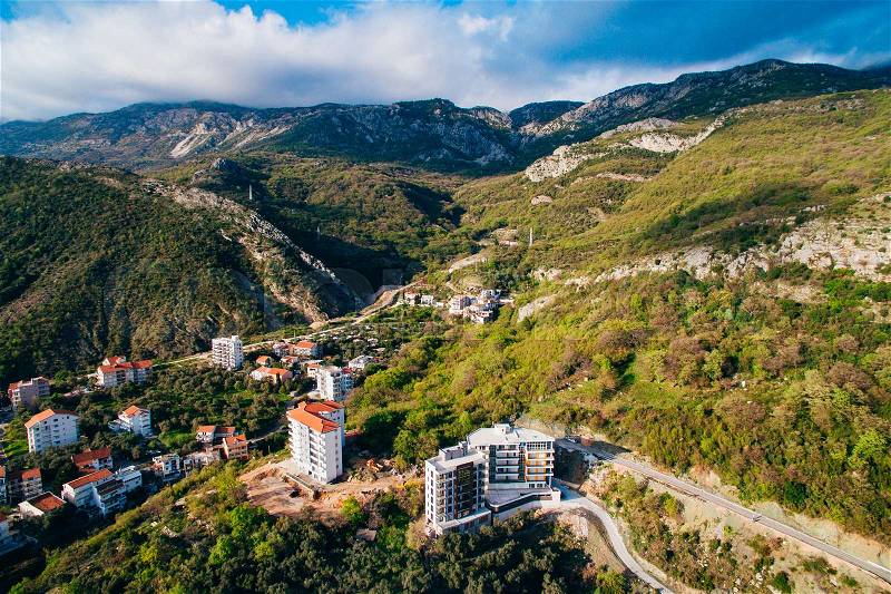 Multi-storey house on the sea. Montenegrin architecture. Real estate on the coast of Montenegro. Aerial Photo Property drone, stock photo