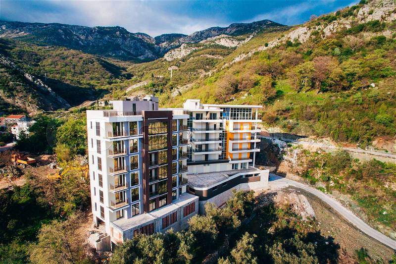 Multi-storey house on the sea. Montenegrin architecture. Real estate on the coast of Montenegro. Aerial Photo Property drone, stock photo