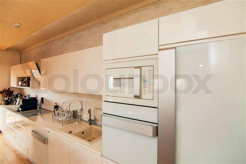 Refrigerator in the kitchen. Home appliances for the kitchen, stock photo