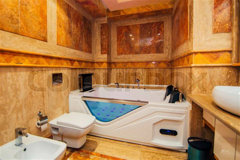 Hot tub in the bathroom. The interior of a bathroom in the apartment, stock photo