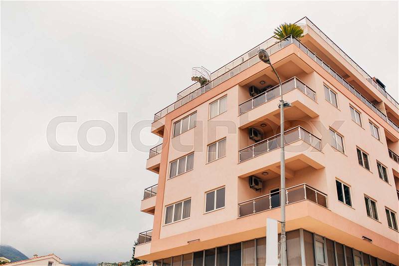 Multi-storey house on the sea. Montenegrin architecture. Real estate on the coast of Montenegro, stock photo