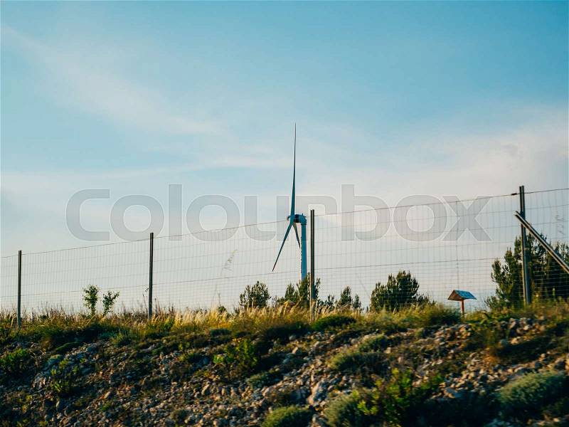 Wind power plant in the fields and mountains of Croatia, stock photo