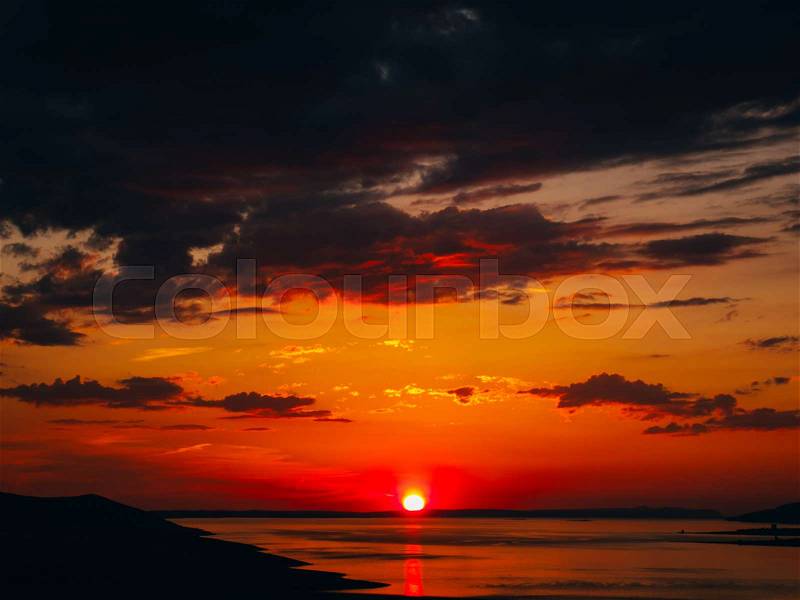 Sunset over the sea. Sunset over the Adriatic Sea. Sun to sit down in the water, stock photo