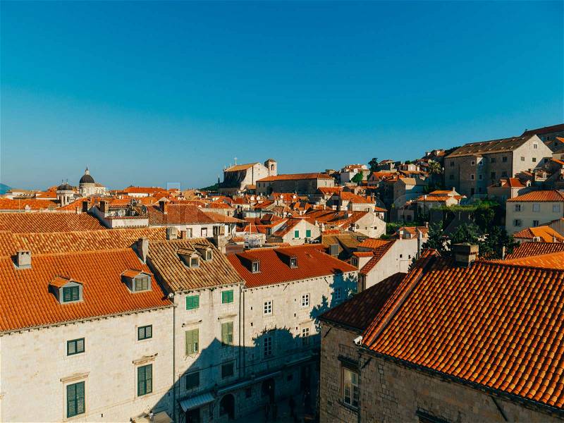 Dubrovnik Old Town, Croatia. Tiled roofs of houses. Church in the city. City View from the wall, stock photo
