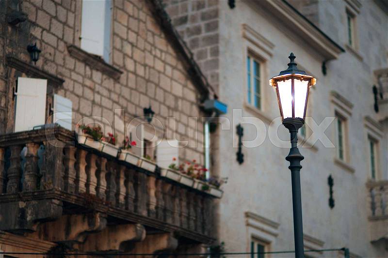 Vintage lamp on the wall on the street, stock photo