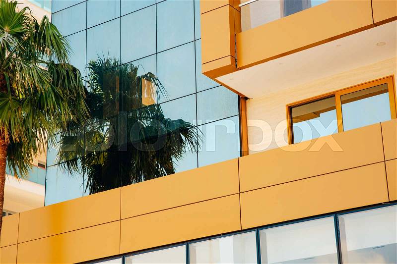 The facade of the office building. Mirror windows in the building, stock photo