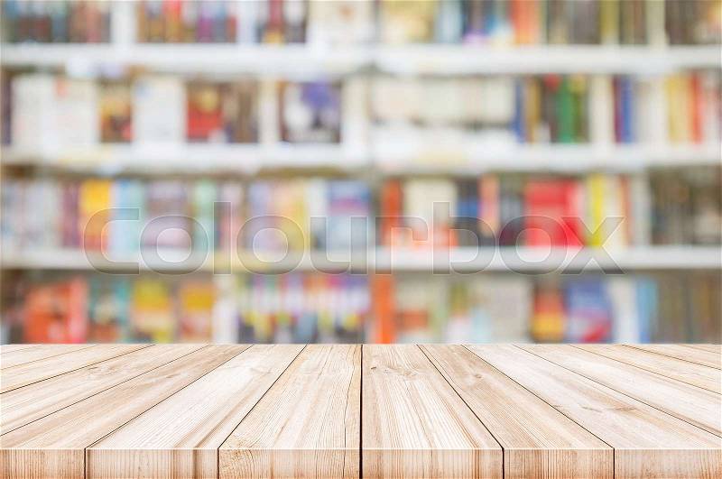 Empty wooden table top with Blur bookshelves in bookstore background. can be used product display. , stock photo