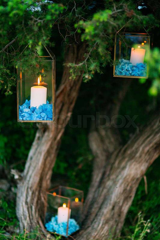 Candles in glass lamps. Wedding decorations. Wedding in Montenegro, stock photo