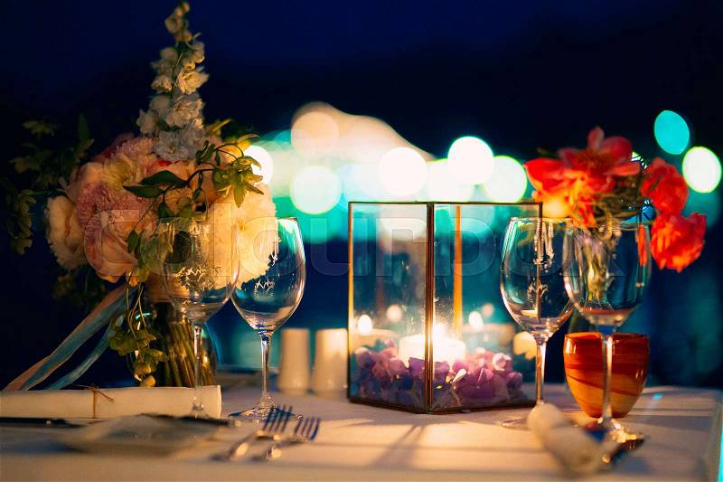 Wedding dinner by candlelight. Wedding decorations at night, stock photo