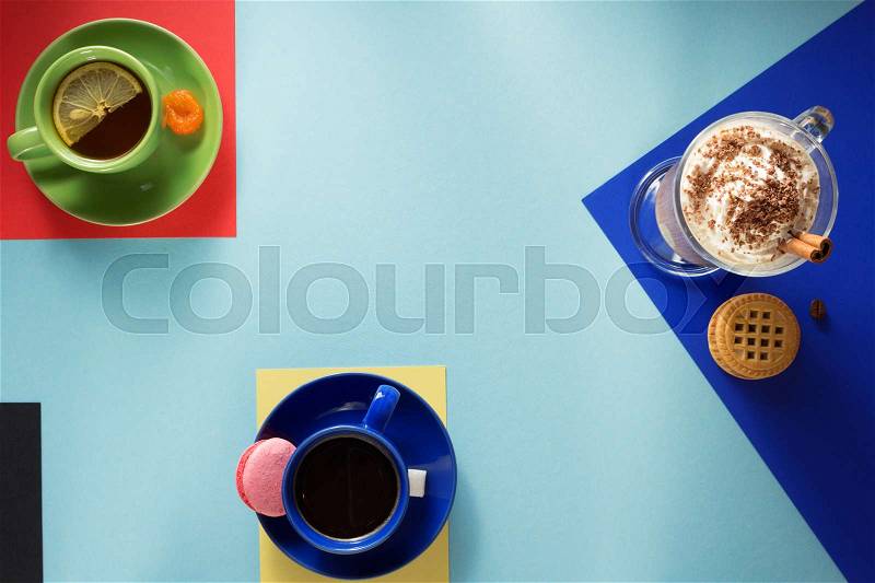Cup of coffee, tea and cacao at paper background, stock photo
