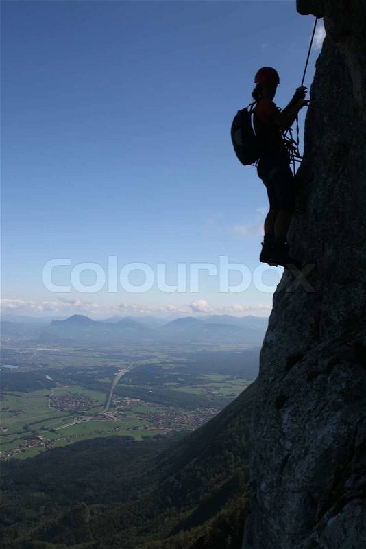 Extreme sport - silhouette of a climber, stock photo