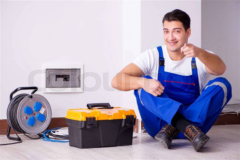 Man doing electrical repairs at home, stock photo
