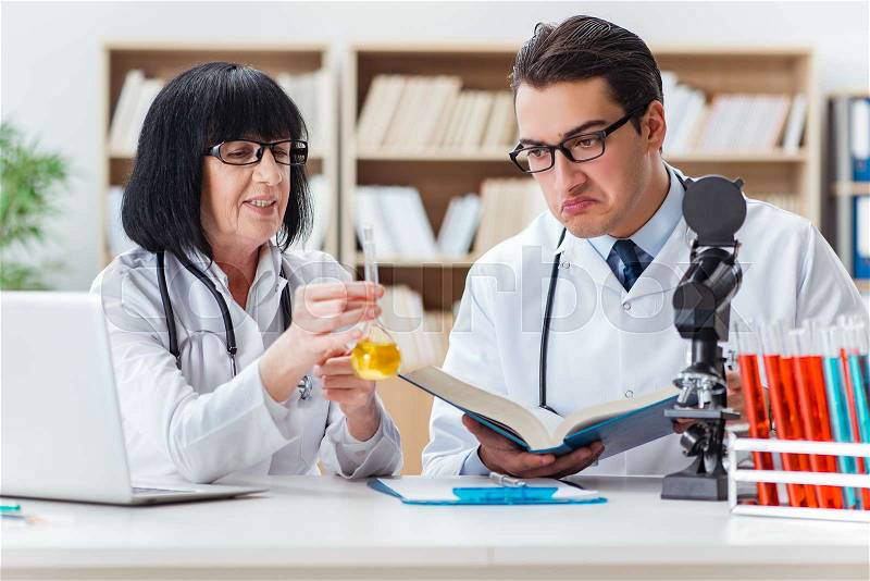 Two doctors working in the lab, stock photo