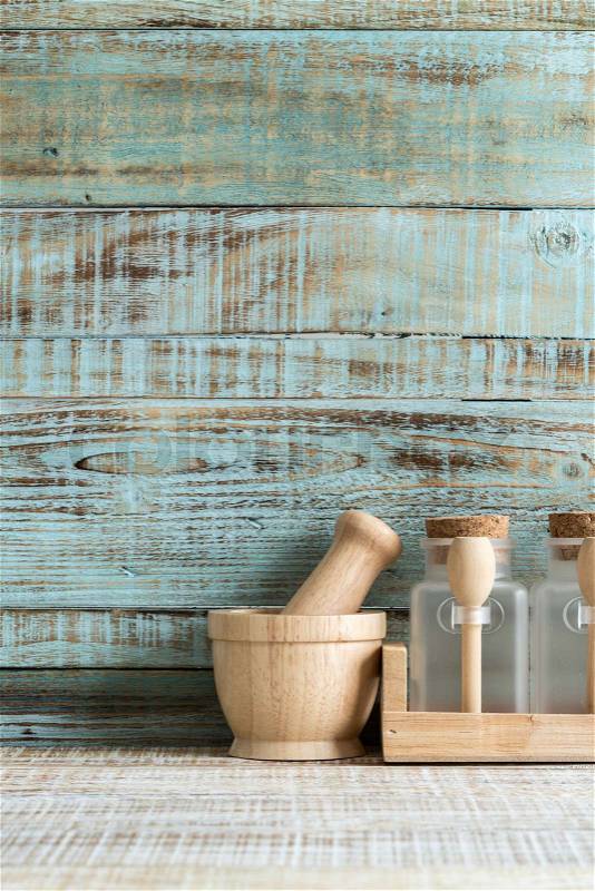Kitchen cooking utensils in wood storage on the wood background, stock photo