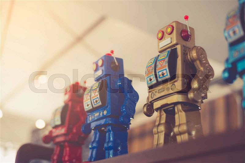 Retro robot made with vintage filter, stock photo