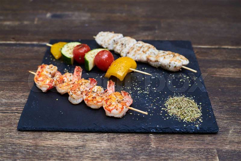 Close up of seafood meet and vegetables on skewers, stock photo