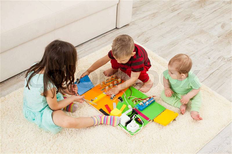 Handmade DIY busy board - sensory children\'s toy, stock photo