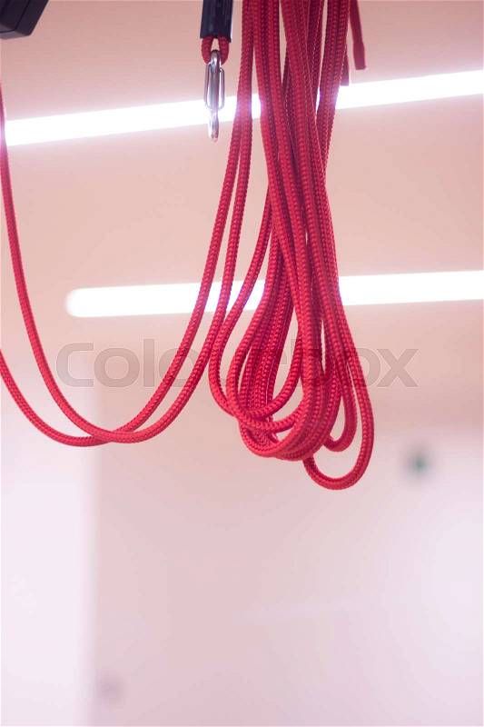 Yoga and pilates studio gym with red cord training equipment for exercise, rehabilitation, physical therapy and workout, stock photo