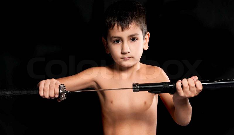 Boy with a samurai sword, stock photo