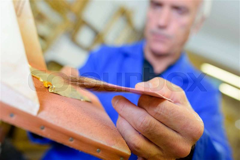 Busy artisan at work, stock photo
