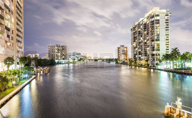 Miami Beach buildings. Night reflections on the river, view from city bridge, stock photo