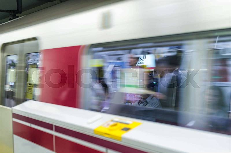 TOKYO - MAY 2016: Subway train arrives in station. This is the best way to move across the city, stock photo