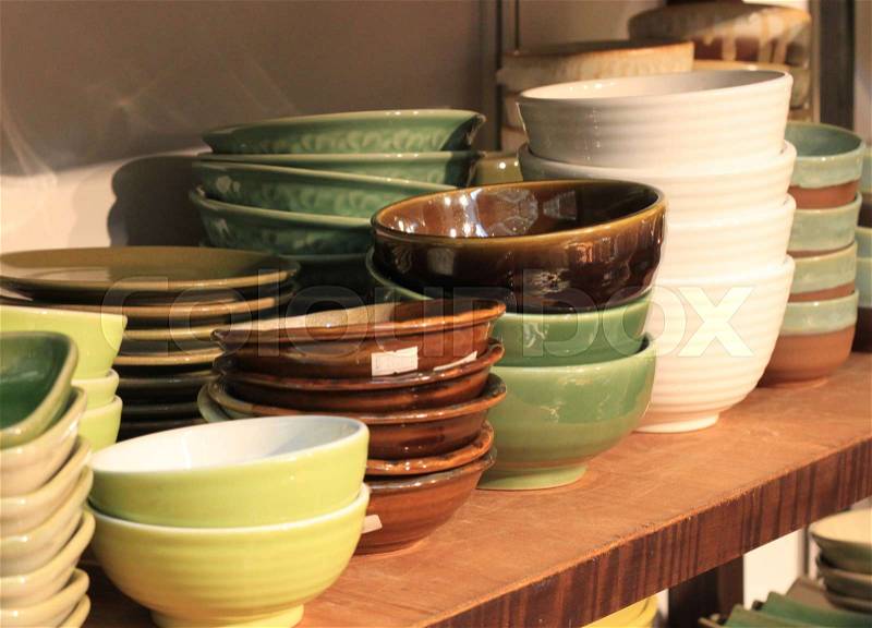Bowl ceramic pottery stacked in store shelf hand made craft collection, stock photo