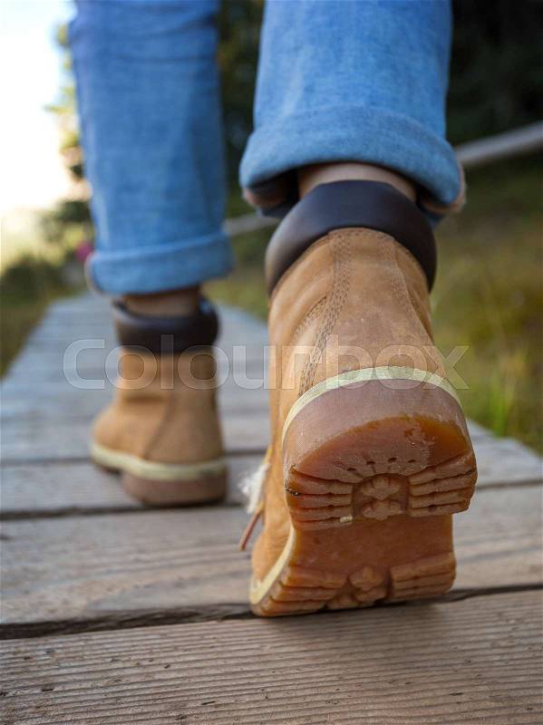 Hiking boots close-up. tourist walking on the trail. Italy , stock photo