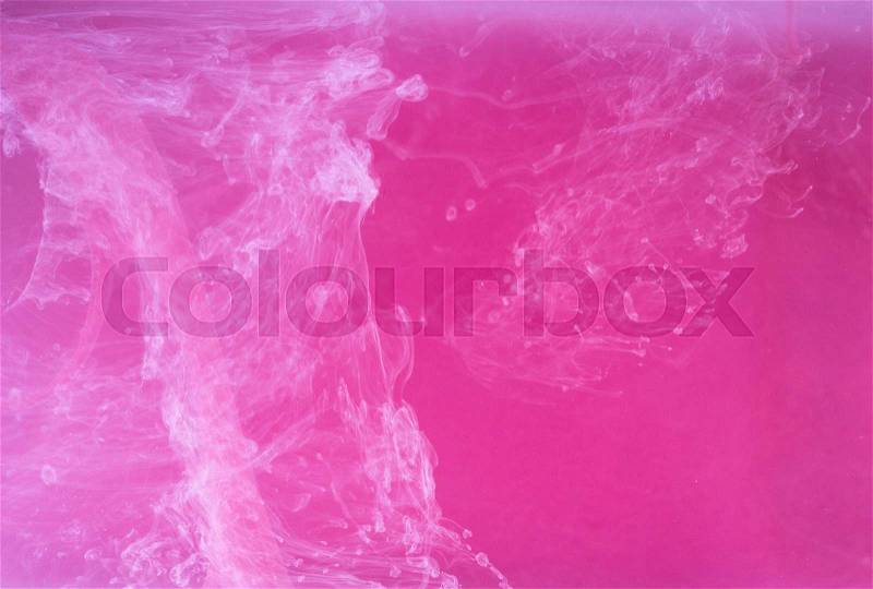 Abstract colored background. Pink smoke, ink in water, the patterns of the universe. Abstract movement, frozen multicolor flow of paint. Horizontal photo with soft focus, blurred backdrop, stock photo