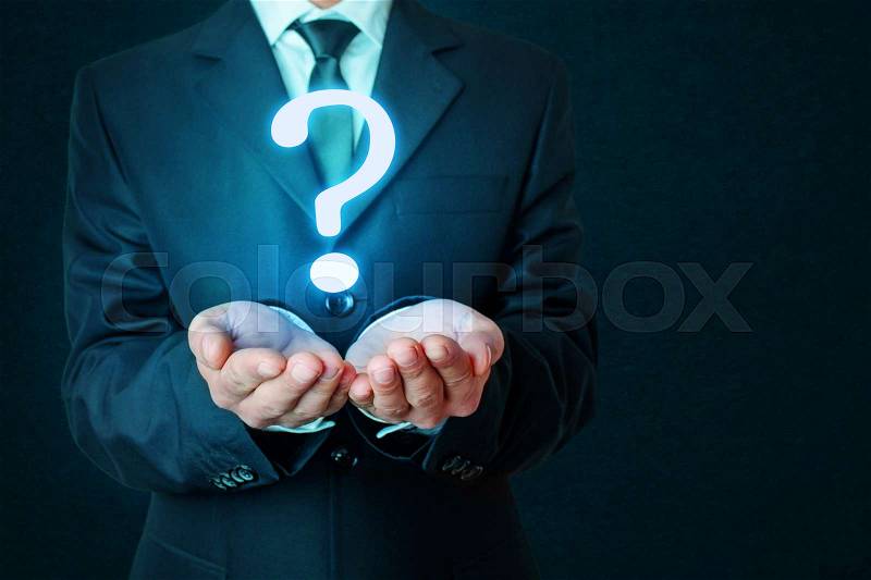 Businessman hands with question mark, stock photo
