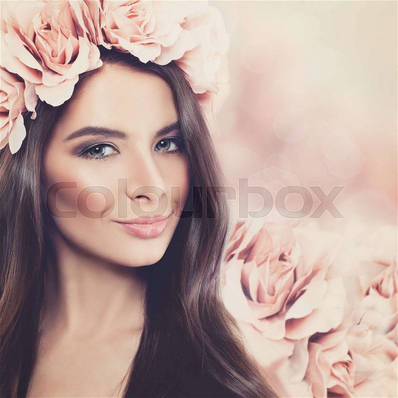 Beautiful Woman with Long Hair, Makeup and Rose Flower Wreath on Floral Blossom Spring Background, stock photo