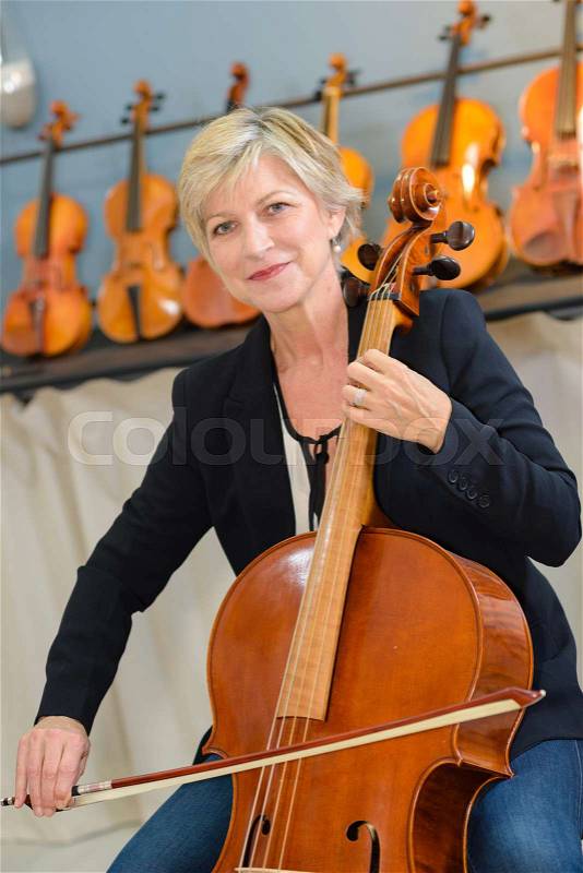 Woman playing the cello, stock photo