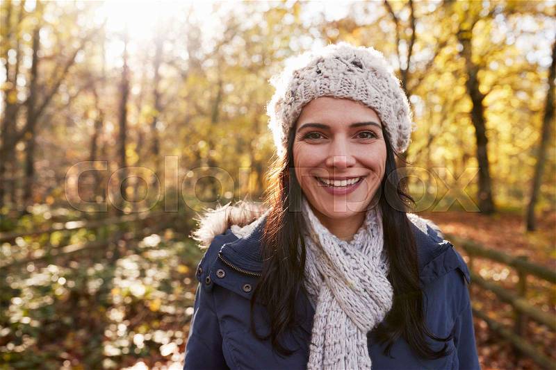 Portrait Of Attractive Woman On Walk In Autumn Countryside, stock photo