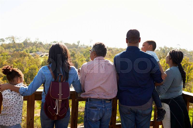 Multi Generation Family Standing On Outdoor Observation Deck, stock photo