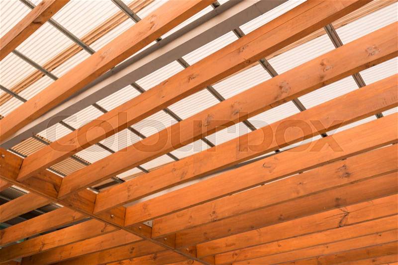 Wooden beams with fiber roof, stock photo