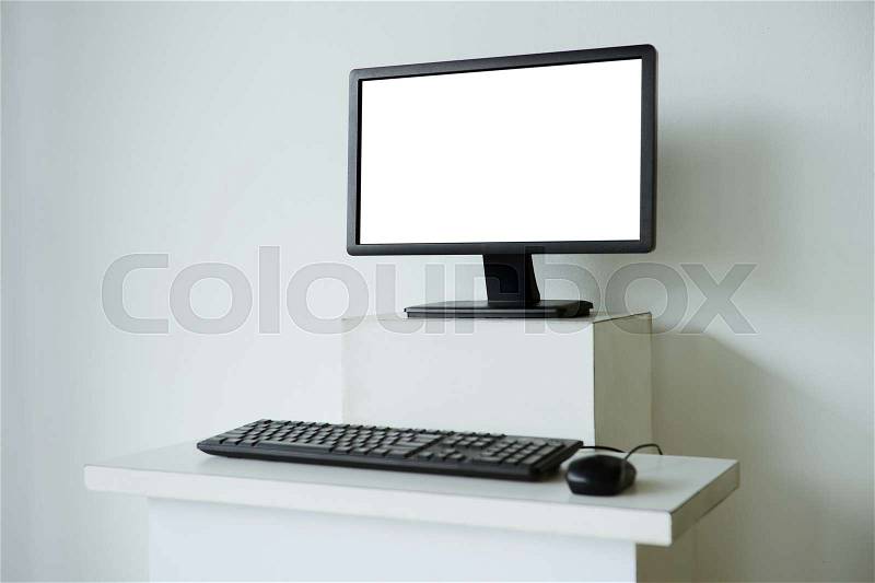 Mock up of computer screen on white table, stock photo