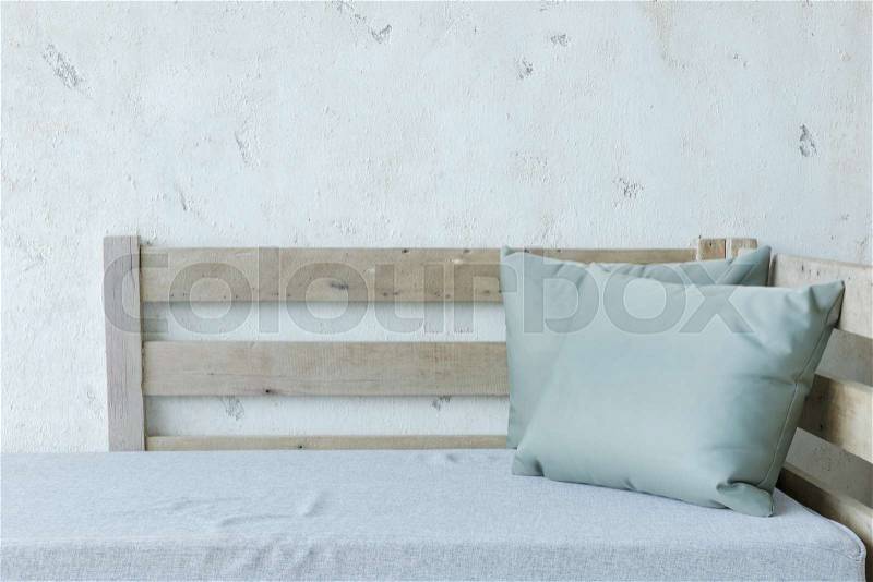 Outdoor furniture, Wooden sofa bed with pillow, stock photo