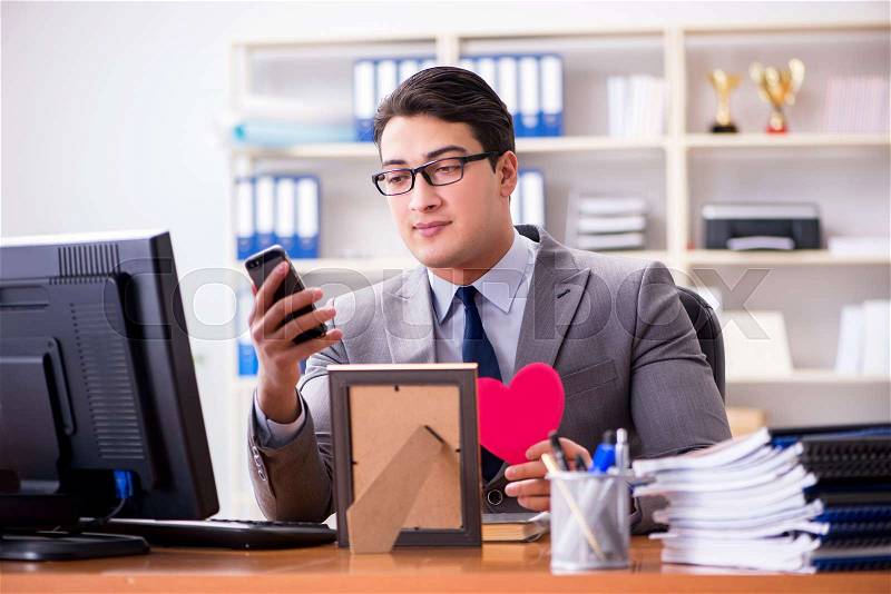 The businessman feeling love and loved in the office, stock photo