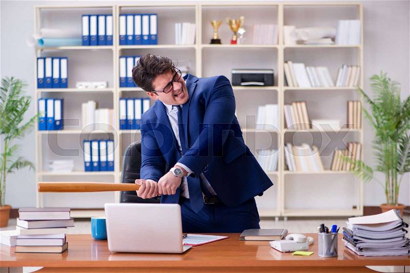 The angry aggressive businessman in the office, stock photo