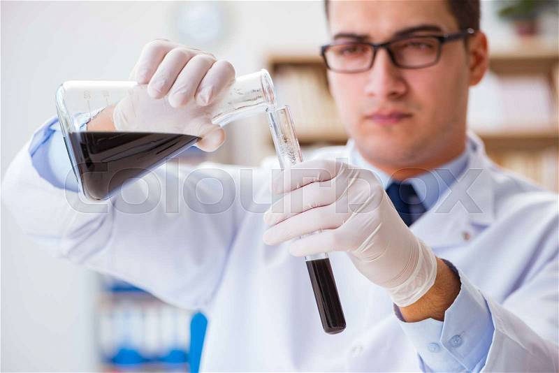 The chemical engineer working on oil samples in lab, stock photo