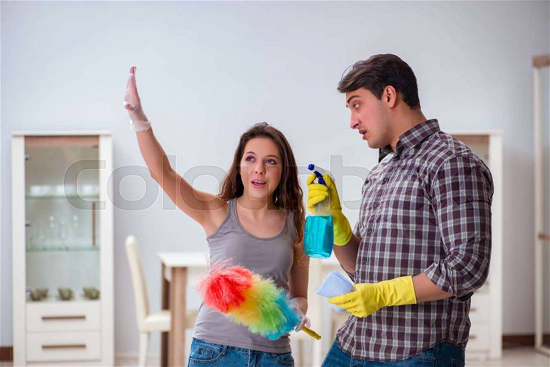 The wife and husband doing cleaning at home, stock photo