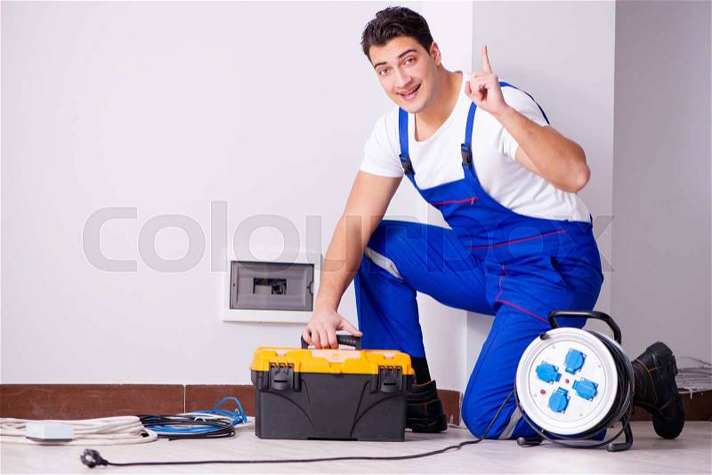 The man doing electrical repairs at home, stock photo