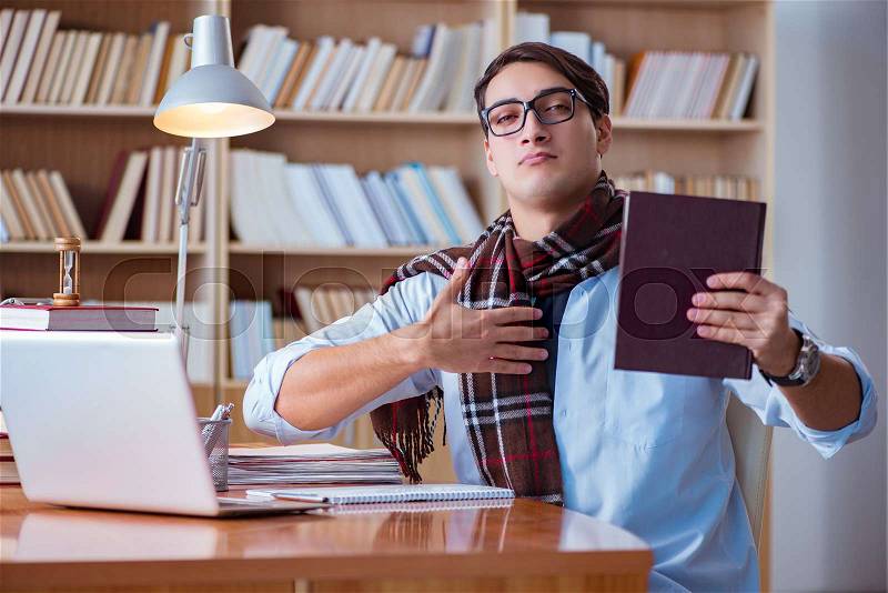 The young book writer writing in library, stock photo